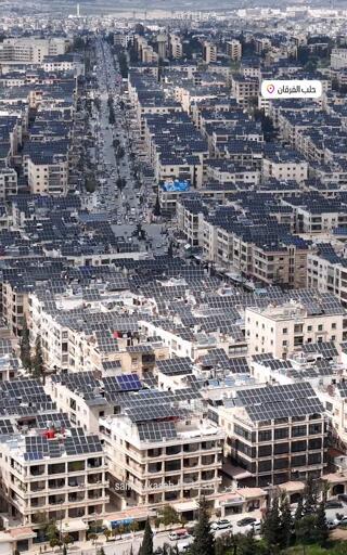 An aerial picture of Aleppo Syria showing a solar panels on almost every rooftop in the city scape.
